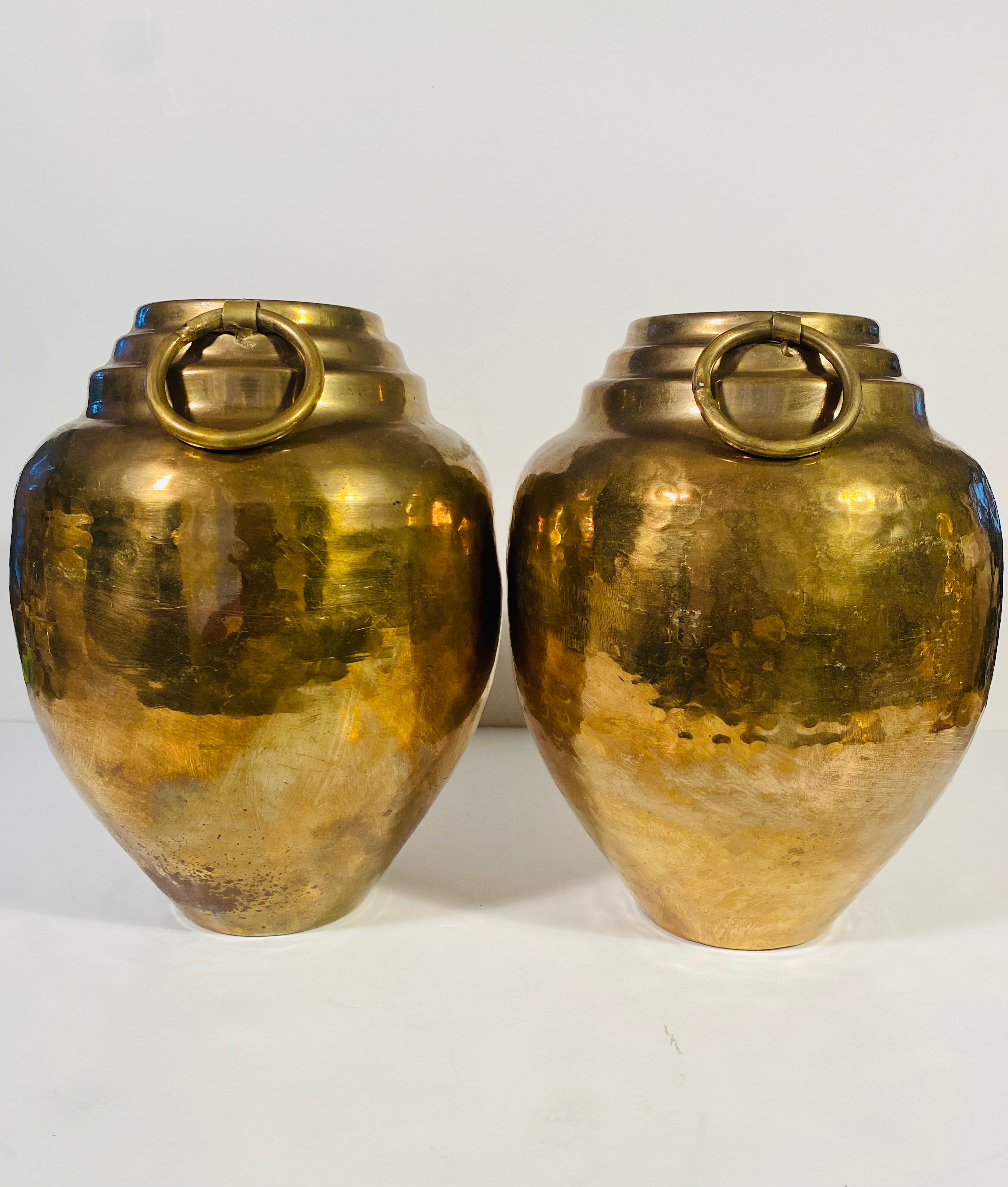 A Pair of Vintage Hammered Brass Vases With Ring Handles