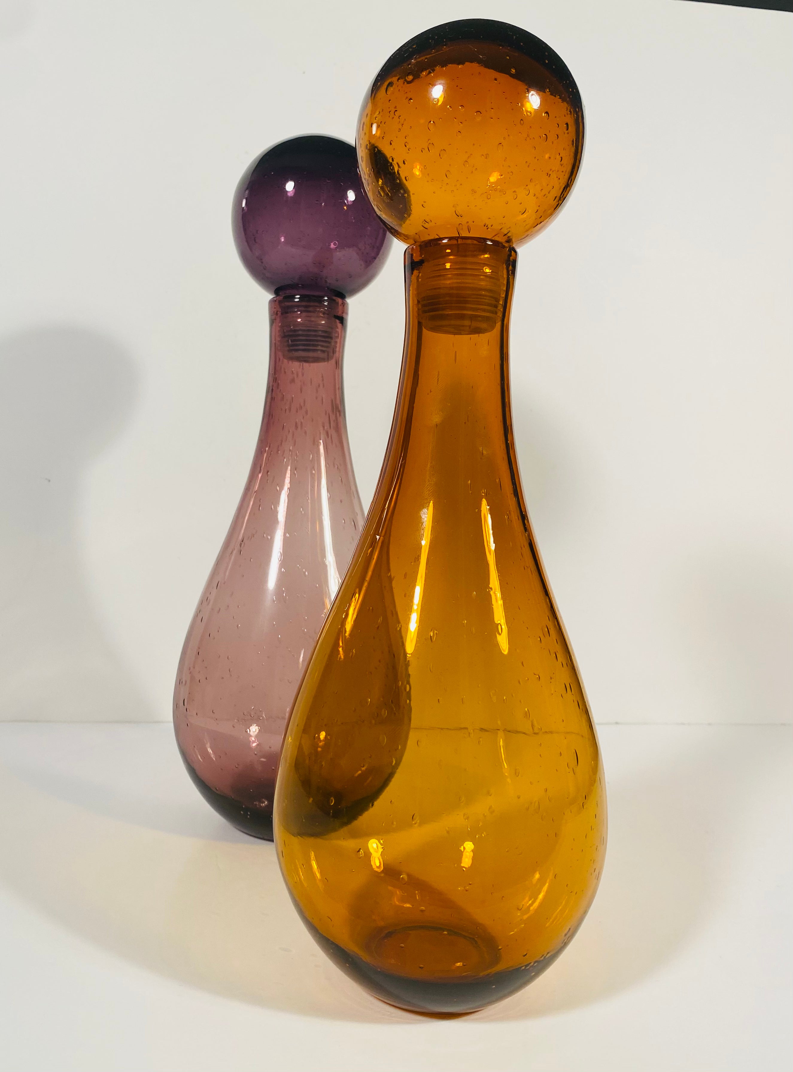 Pair of Elizabeth Lyon's Colored Blown Glass Decanters